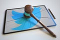 Judge's gavel and broken tablet computer screen with logo of TWITTER. Editorial conceptual 3d rendering