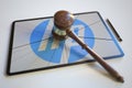 Broken tablet computer screen with logo of HP and judge's gavel. Editorial conceptual 3d rendering