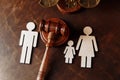 Judge's gavel divide family figures. Family law and divorce concept Royalty Free Stock Photo