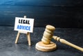 Judge`s gavel and easel with legal advice. Giving advice in the field of jurisprudence. Analysis of the legal aspects of