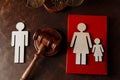 Judge's gavel and family wooden figures. Family law and divorce concept Royalty Free Stock Photo