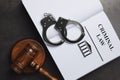 Judge`s gavel, handcuffs and Criminal law book on background, flat lay Royalty Free Stock Photo