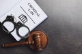 Judge`s gavel, handcuffs and Criminal law book on background, flat lay. Space for text Royalty Free Stock Photo