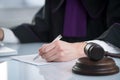 Judge`s gavel. Modern white desk with an open laptop. White background. Royalty Free Stock Photo