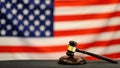 Judge`s gavel and over USA flag. Symbol for jurisdiction. Law concept a wooden judges gavel on table in a courtroom or Royalty Free Stock Photo