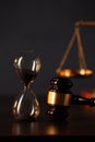 Judge`s gavel, scales of justice and hourglass on wooden table. Law and justice concept Royalty Free Stock Photo