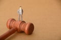 the judge's gavel stands ready to deliver justice, weighing the actions of a corrupt businessman Royalty Free Stock Photo