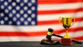 Judge`s gavel and trophy USA flag. Symbol for jurisdiction. Law concept a wooden judges gavel on table in a courtroom or Royalty Free Stock Photo