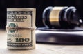 Judge`s hammer gavel. Justice dollars banknotes and usa flag in the background. Court gavel and rolled banknotes. Royalty Free Stock Photo