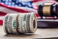 Judge`s hammer gavel. Justice dollars banknotes and usa flag in the background. Court gavel and rolled banknotes. Royalty Free Stock Photo