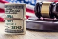 Judge`s hammer gavel. Justice dollars banknotes and usa flag in the background. Court gavel and rolled banknotes. Royalty Free Stock Photo