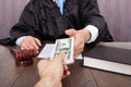Judge taking bribe from client Royalty Free Stock Photo