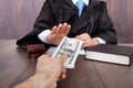 Judge taking bribe from client Royalty Free Stock Photo