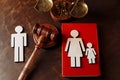 Judge's gavel divide family wooden figures. Family law book and divorce Royalty Free Stock Photo