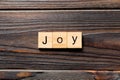Joy word written on wood block. joy text on table, concept Royalty Free Stock Photo