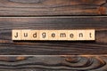 Judgement word written on wood block. judgement text on table, concept Royalty Free Stock Photo