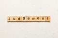 judgement word written on wood block. judgement text on table, concept Royalty Free Stock Photo