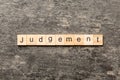 judgement word written on wood block. judgement text on table, concept Royalty Free Stock Photo