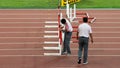 Judges arranging hurdles before final competition at IAAF World Championships in Beijing, China