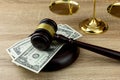 Judges gavel on dollar with wooden Royalty Free Stock Photo