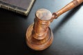 Judges Gavel And Old Book On The Black Wooden Table Royalty Free Stock Photo