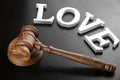 Judges Gavel And Sign Love On The Black Wood Background Royalty Free Stock Photo