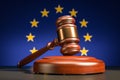 Judges wooden gavel with EU flag in the background. Region court system