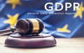 Judges wooden gavel with EU flag in the background with text GDP