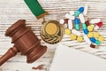 Judicial hammer, medal and pills