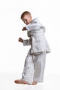 Judo boy practicing to do a sweep Royalty Free Stock Photo