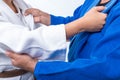 Judo Gripping between female judo brown belt and her sensei black belt