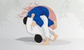 A judo wrestling athlete makes a throw through the hip