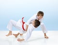 In judogi boys are training judo throws Royalty Free Stock Photo