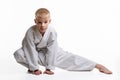 Judoka boy doing stretching at workout Royalty Free Stock Photo