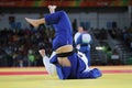 Judoka Henk Grol of Netherlands in white in action against Kyle Reyes of Canada during during men -100 kg match of the Rio 2016