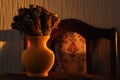 Jug with a bouquet of dried leaves resembling roses