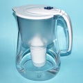 A jug for filtering water on a blue background