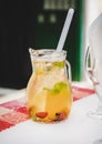 Jug of fresh cold white wine Sangria with fruit Royalty Free Stock Photo