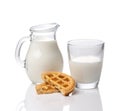 Jug and glass with milk and cookies with jam isolated on white background Royalty Free Stock Photo