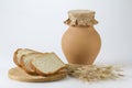 Jug of milk with freshly baked white bread and wheat ears Royalty Free Stock Photo