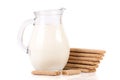 Jug of milk with stack of grain crispbreads isolated on white background Royalty Free Stock Photo