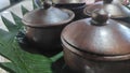 A jug of traditional Javanese food on a banana leaf base