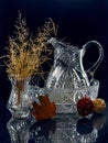 Jug and vase with dried flowers. Crystal. Still life.
