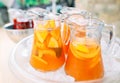 Jugs of fruit lemonade in the ice. Royalty Free Stock Photo