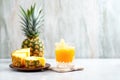 juice in crystal glass, pineapple slice on rim