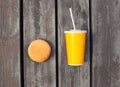 juice cup and hamburger on a wooden table or floor background Royalty Free Stock Photo