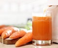 Juice extractor and carrot juice Royalty Free Stock Photo