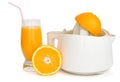 Juice extractor with a glass of orange juice