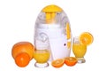 Juice extractor and oranges Royalty Free Stock Photo