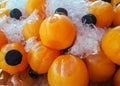 Juice for health - Squeezed orange juice in many clear plastic bottles, soaked in frozen water to keep cool Royalty Free Stock Photo